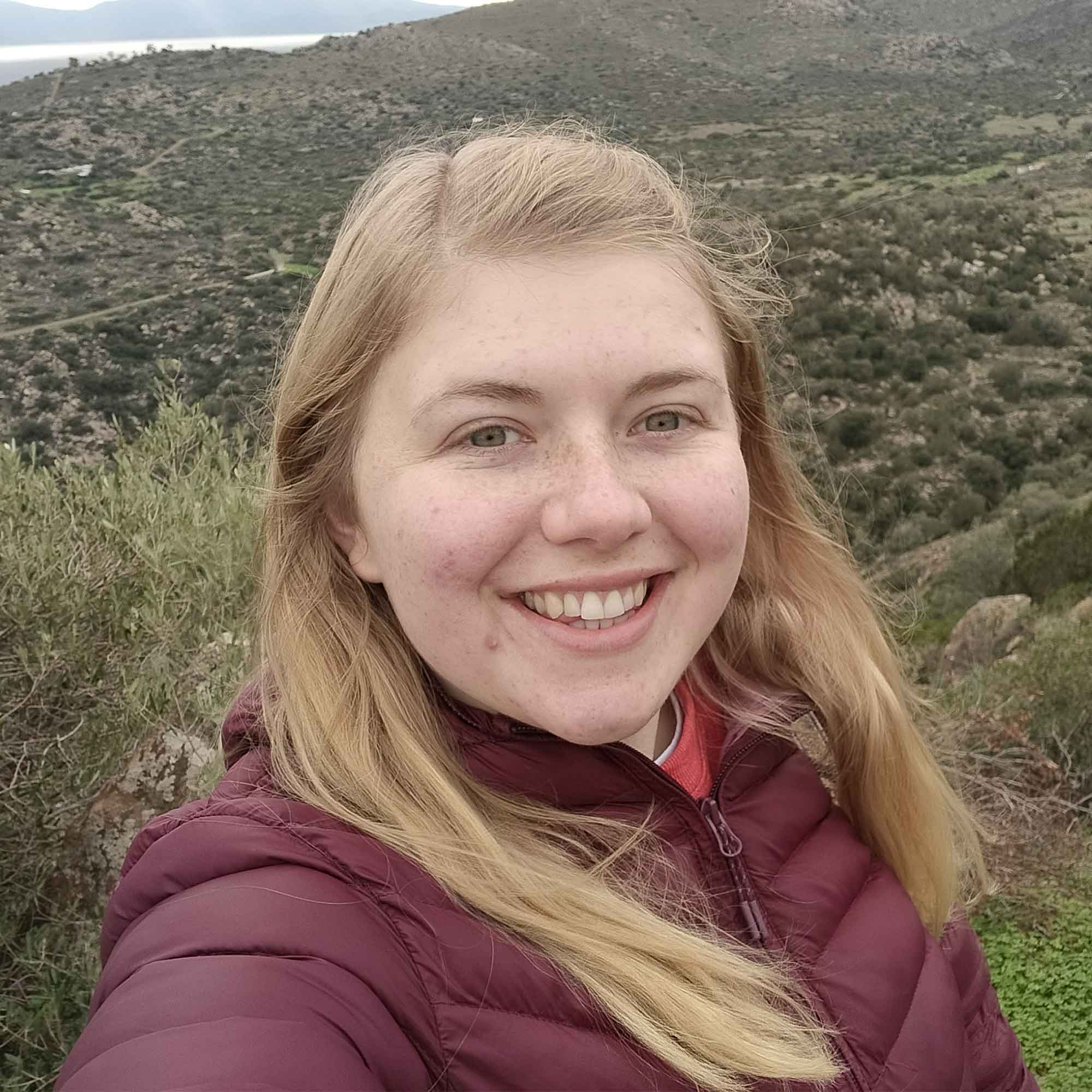 Fern Baker smiling at the camera stood outside.